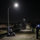People fish off the Ocean Beach pier before an imposed curfew on November 21, 2020 in San Diego, California.
